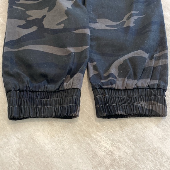 Black camo pants. New. No tags. 2 side pockets. Elastic at ankles. 1 pocket back - Picture 3 of 4